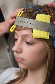 Woman using transcranial direct stimulation